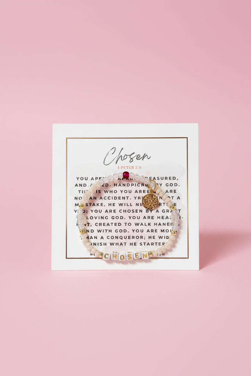 Gold bracelet with 'Chosen' charm on a card with text in a pink box